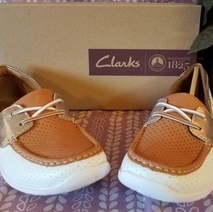 Clark's suede slip on boat shoes. Tan white gold.